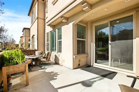 a view of a chairs and table in the patio