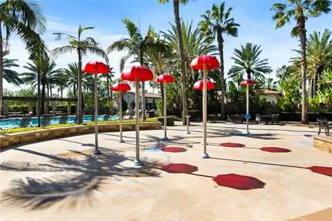 a green field with trees in the background