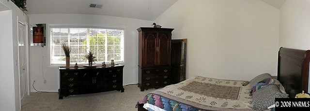 35 Telluride Court Reno, NV 89511 - Photo 4 of 8 a bedroom with a bed and a window