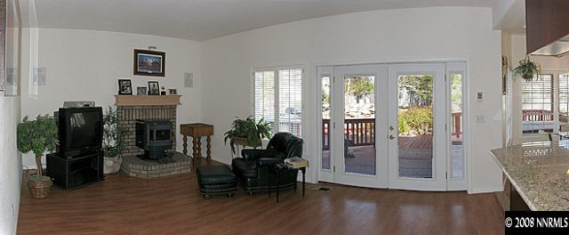 35 Telluride Court Reno, NV 89511 - Photo 5 of 8 a living room with fireplace furniture and a flat screen tv
