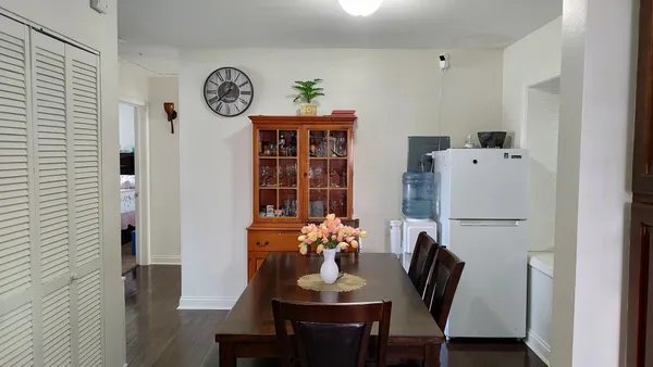 a dining room with furniture and window