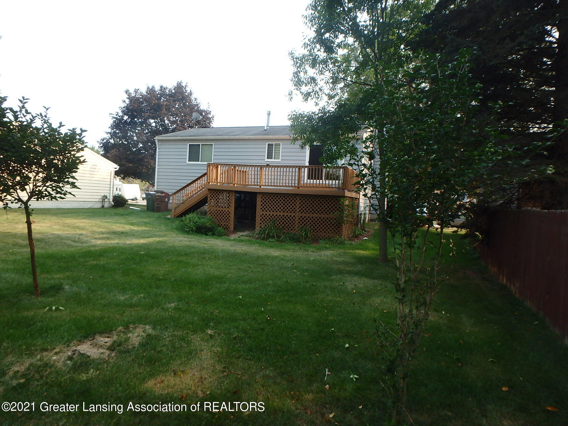 5905 Rockingham Drive Lansing, MI 48911 - Photo 4 of 30 deck, storage back yard