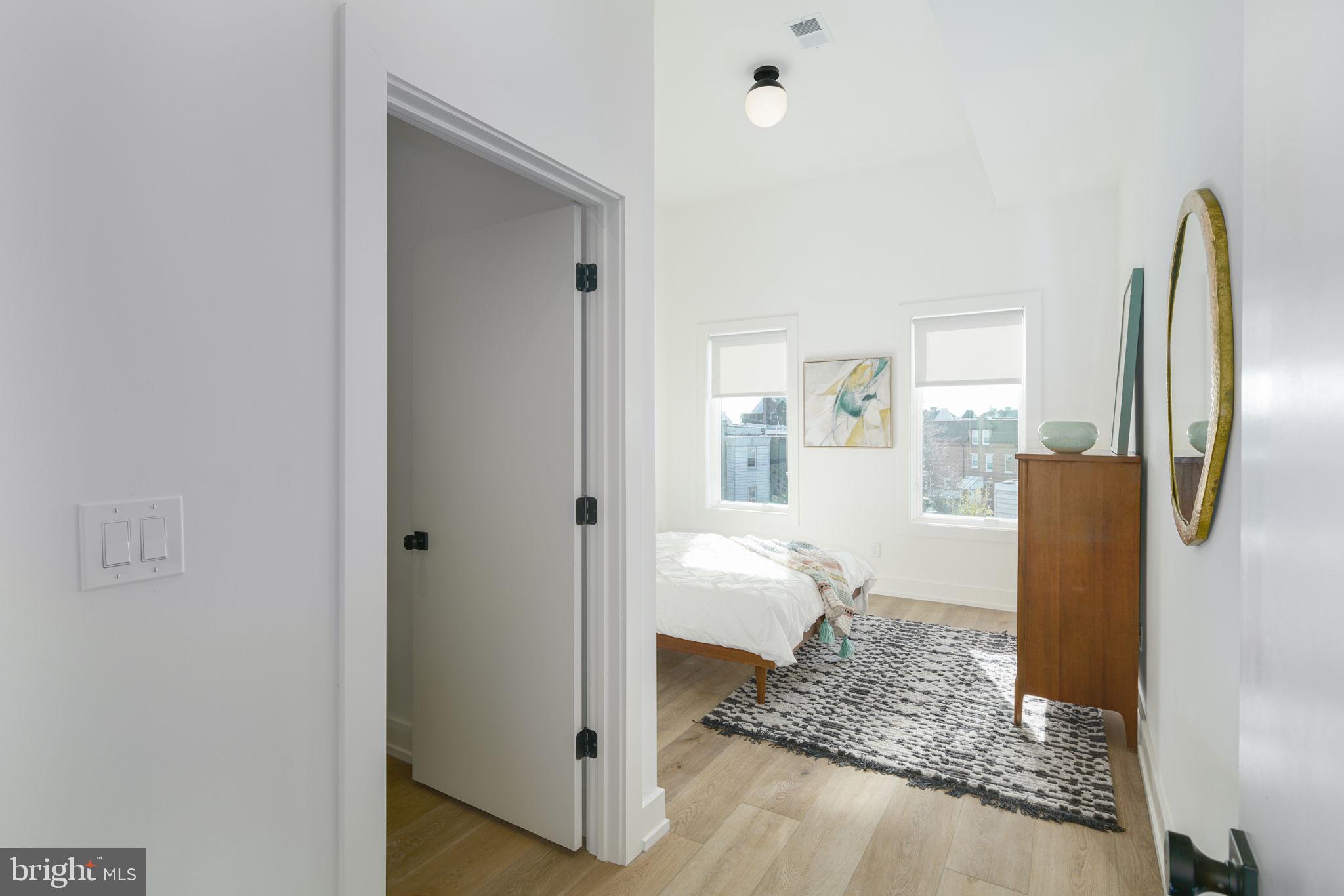 5013 Springfield Avenue, Unit 515 Philadelphia, PA 19143 - Photo 14 of 21 a view of a kitchen with refrigerator and room
