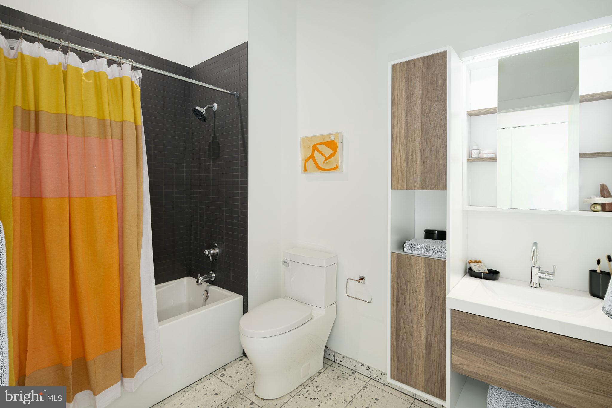 5013 Springfield Avenue, Unit 515 Philadelphia, PA 19143 - Photo 15 of 21 a bathroom with a toilet and a bathtub