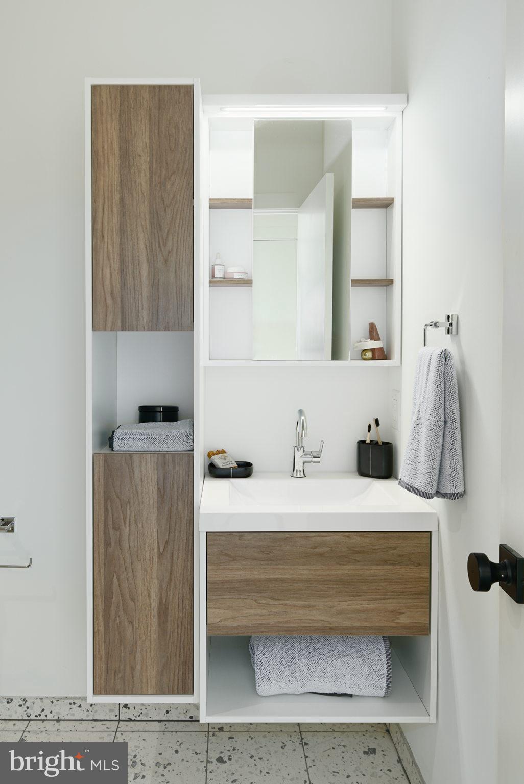 5013 Springfield Avenue, Unit 515 Philadelphia, PA 19143 - Photo 16 of 21 a bathroom with a sink and a mirror