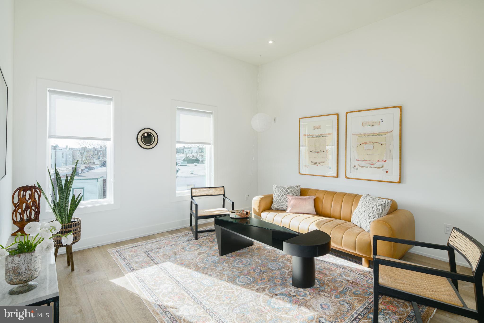 5013 Springfield Avenue, Unit 515 Philadelphia, PA 19143 - Photo 2 of 21 a living room with furniture and wooden floor