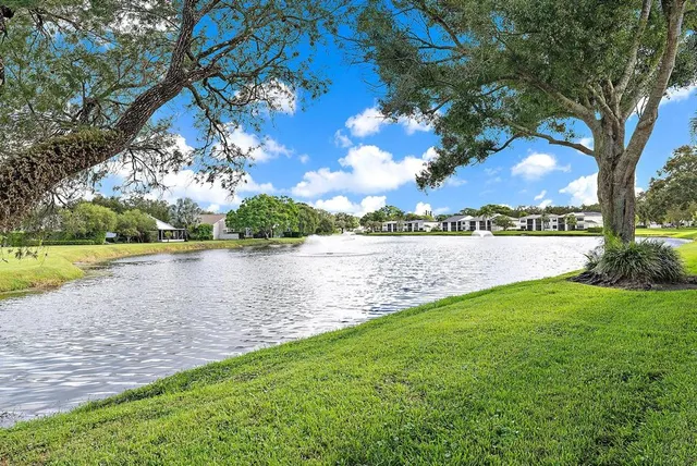 an aerial view of a house with a garden and swimming pool