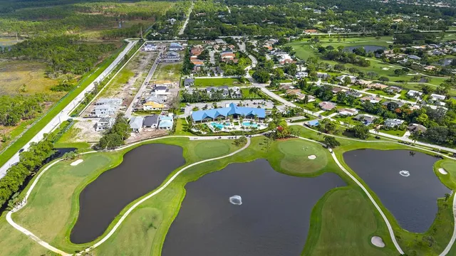 a kitchen with stainless steel appliances kitchen island granite countertop a stove a sink and a microwave