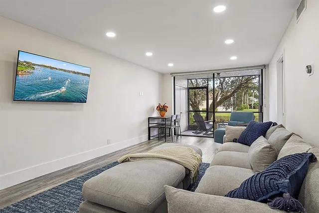 a living room with furniture and a large window
