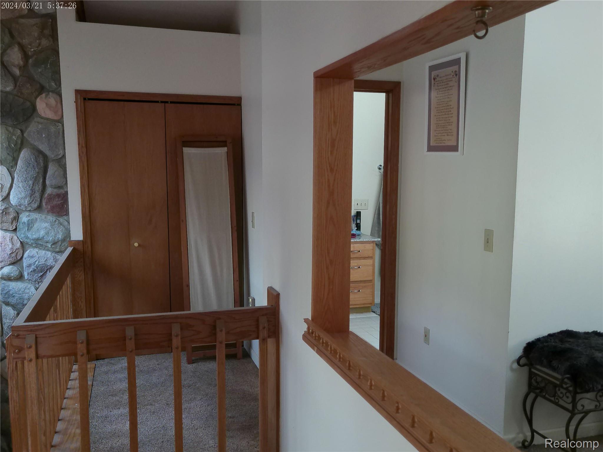 6140 McGuire Road Fenton, MI 48430 - Photo 26 of 48 Hallway featuring an upstairs landing and carpet floors