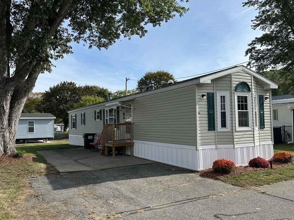 72 Quaboag Valley, Unit 70 Palmer, MA 01069 - Photo 1 of 21 a front view of a house with garage