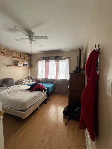 a bedroom with bed and window