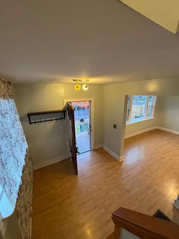 a view of an empty room with a window