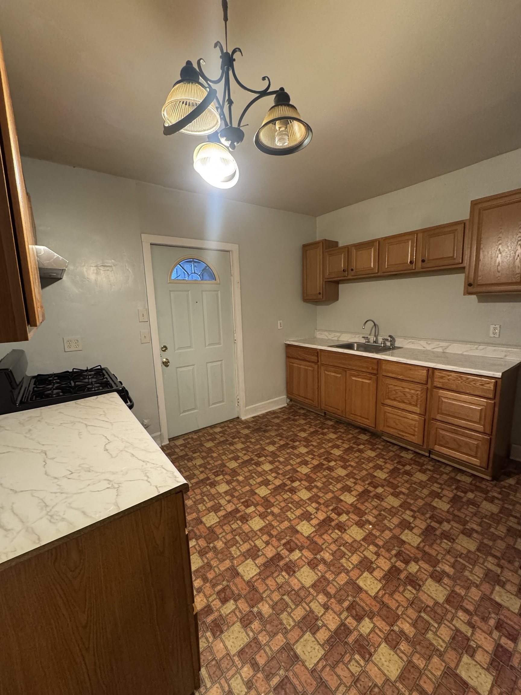 731 George Street New Haven, CT 06511 - Photo 16 of 25 a view of a kitchen with a sink and cabinets