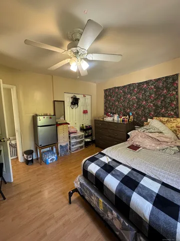 a bedroom with a bed and furniture