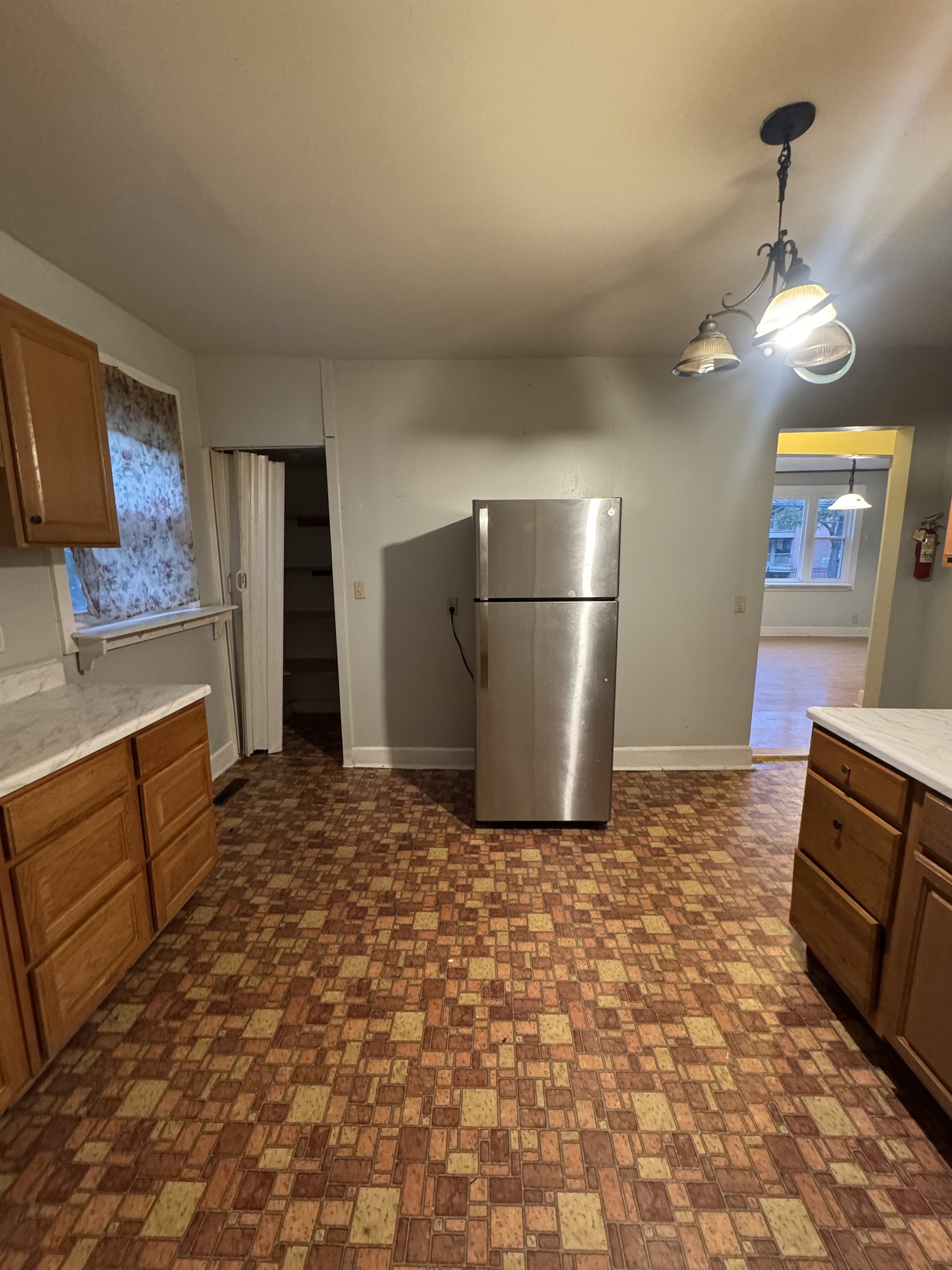 731 George Street New Haven, CT 06511 - Photo 18 of 25 a kitchen with a refrigerator and a stove top oven