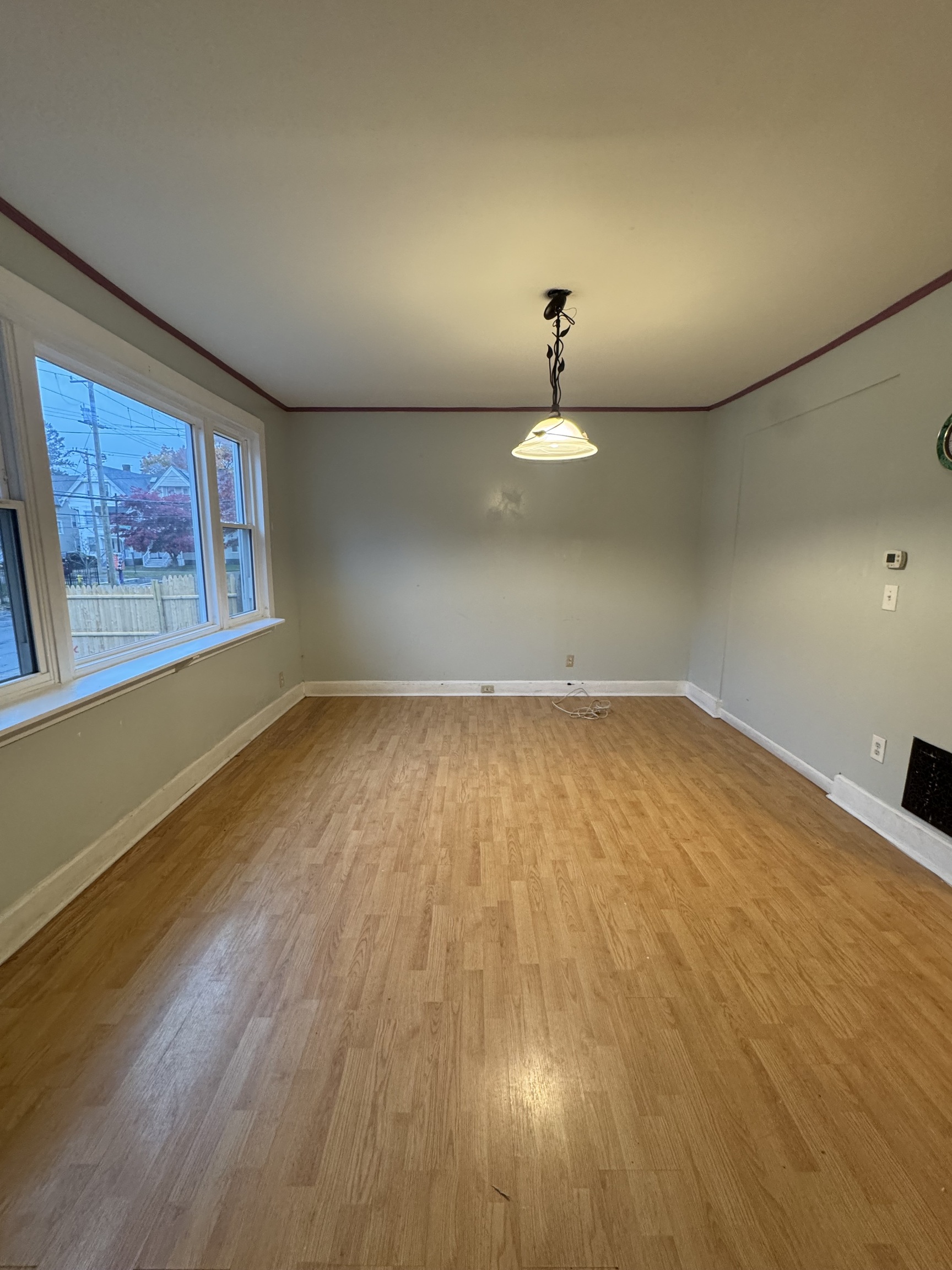 731 George Street New Haven, CT 06511 - Photo 2 of 25 an empty room with wooden floor and windows