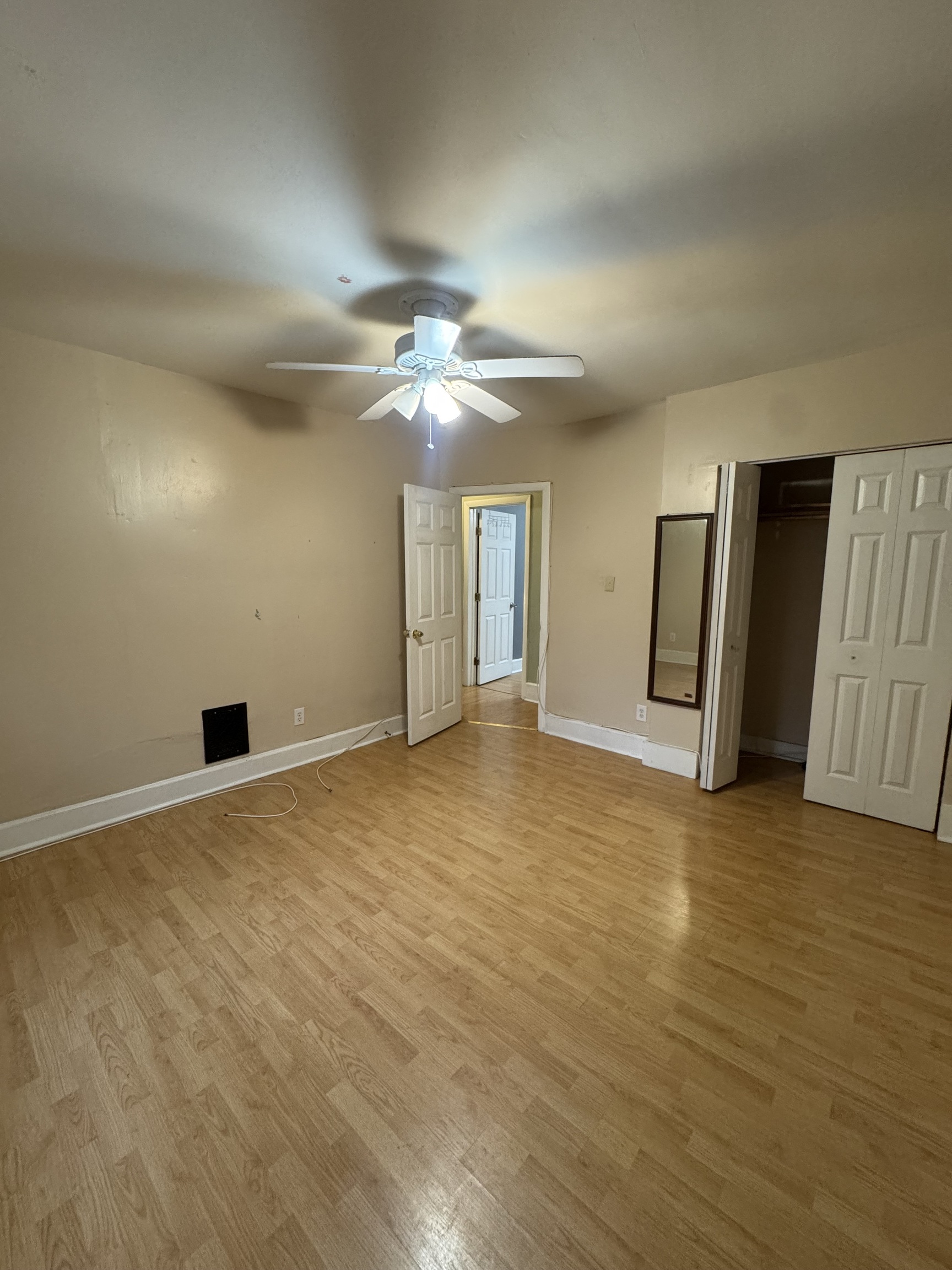 731 George Street New Haven, CT 06511 - Photo 4 of 25 an empty room with wooden floor and natural light