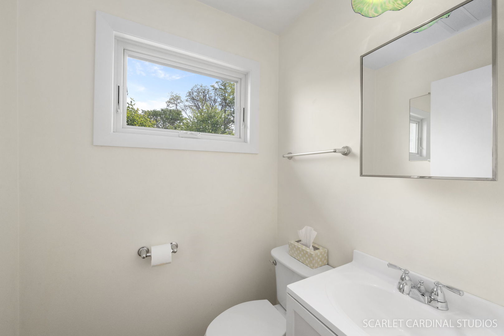 472 Sunnybrook Lane Wheaton, IL 60187 - Photo 5 of 11 a bathroom with a toilet sink and mirror