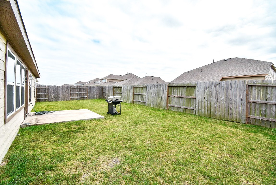 5912 Whitewing Road Rosenberg, TX 77469 - Photo 7 of 25 Spacious and private backyard, perfect for outdoor gatherings and relaxation.