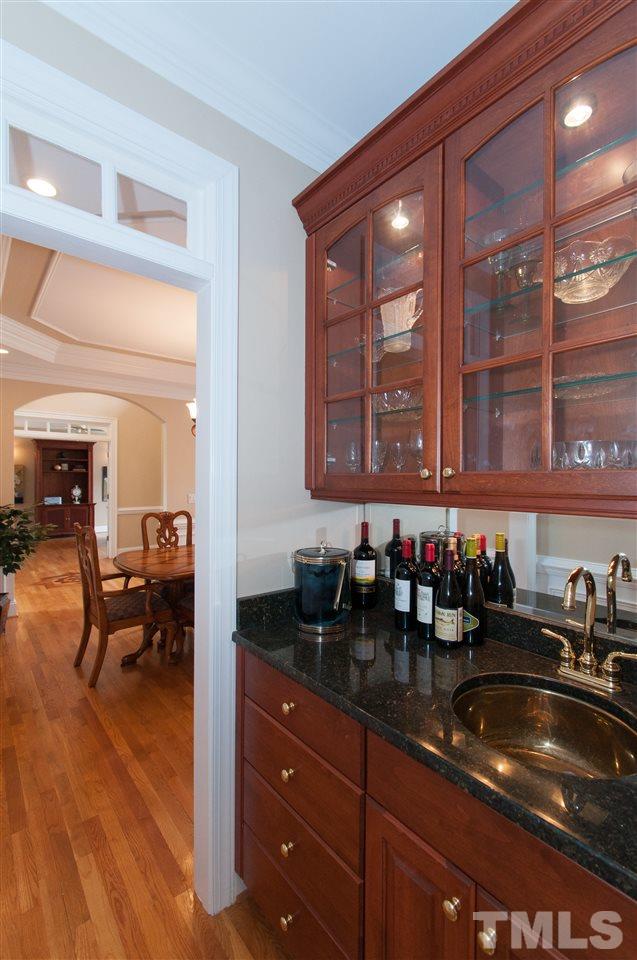 10529 Charmford Way Raleigh, NC 27615 - Photo 14 of 25 a kitchen with a sink and cabinets