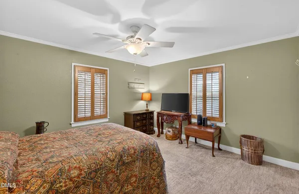 a bedroom with a bed and a desk