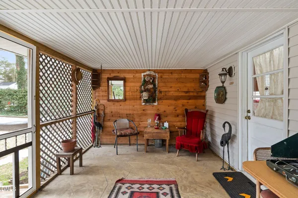 a view of a livingroom with furniture and windows
