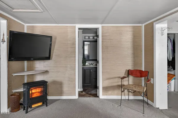 a view of a livingroom with furniture and a ceiling fan