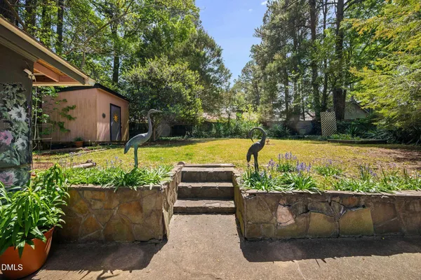 a view of a bench in a backyard