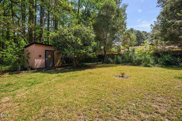 a backyard of a house with lots of green space
