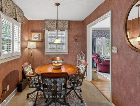 a dining room with furniture and window
