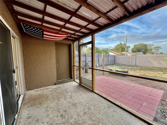 a view of a room with a table and chairs