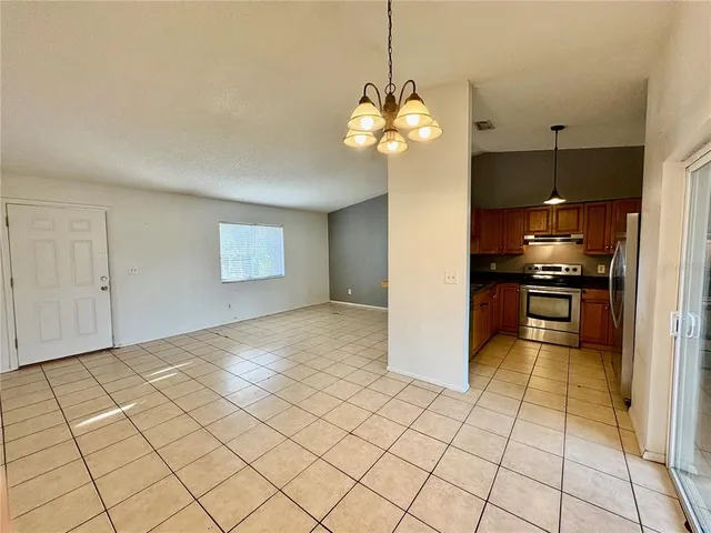 a view of a kitchen with a sink and cabinets