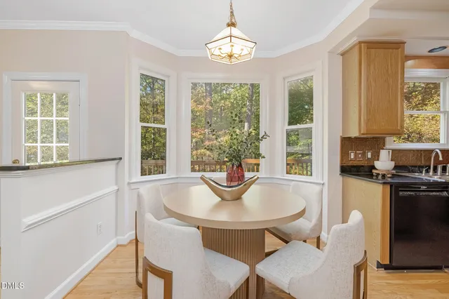 a living room with furniture kitchen view and a dining table