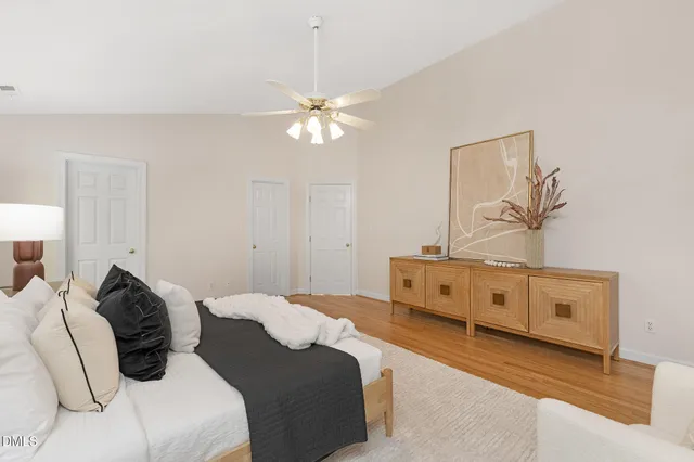 a bed room with a bed and a chandelier