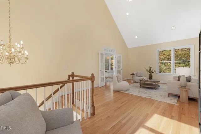 a view of staircase with wooden floor and window