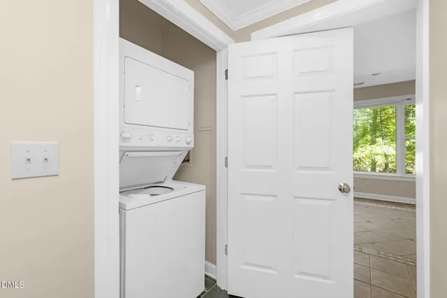 a kitchen with a stove a refrigerator and cabinets