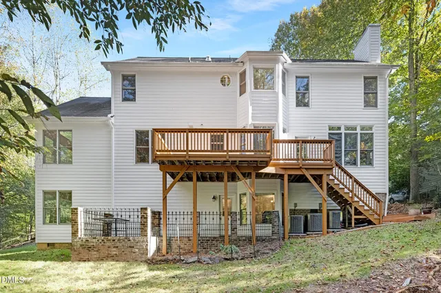 a view of a porch with wooden floor and roof