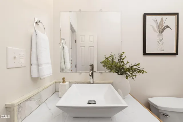 a dining room with furniture a window and a chandelier
