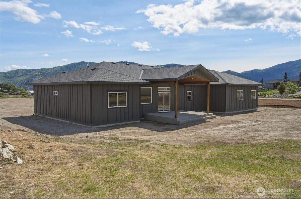 110 Slide View Lane Manson, WA 98831 - Photo 35 of 38 a view of a house with a yard