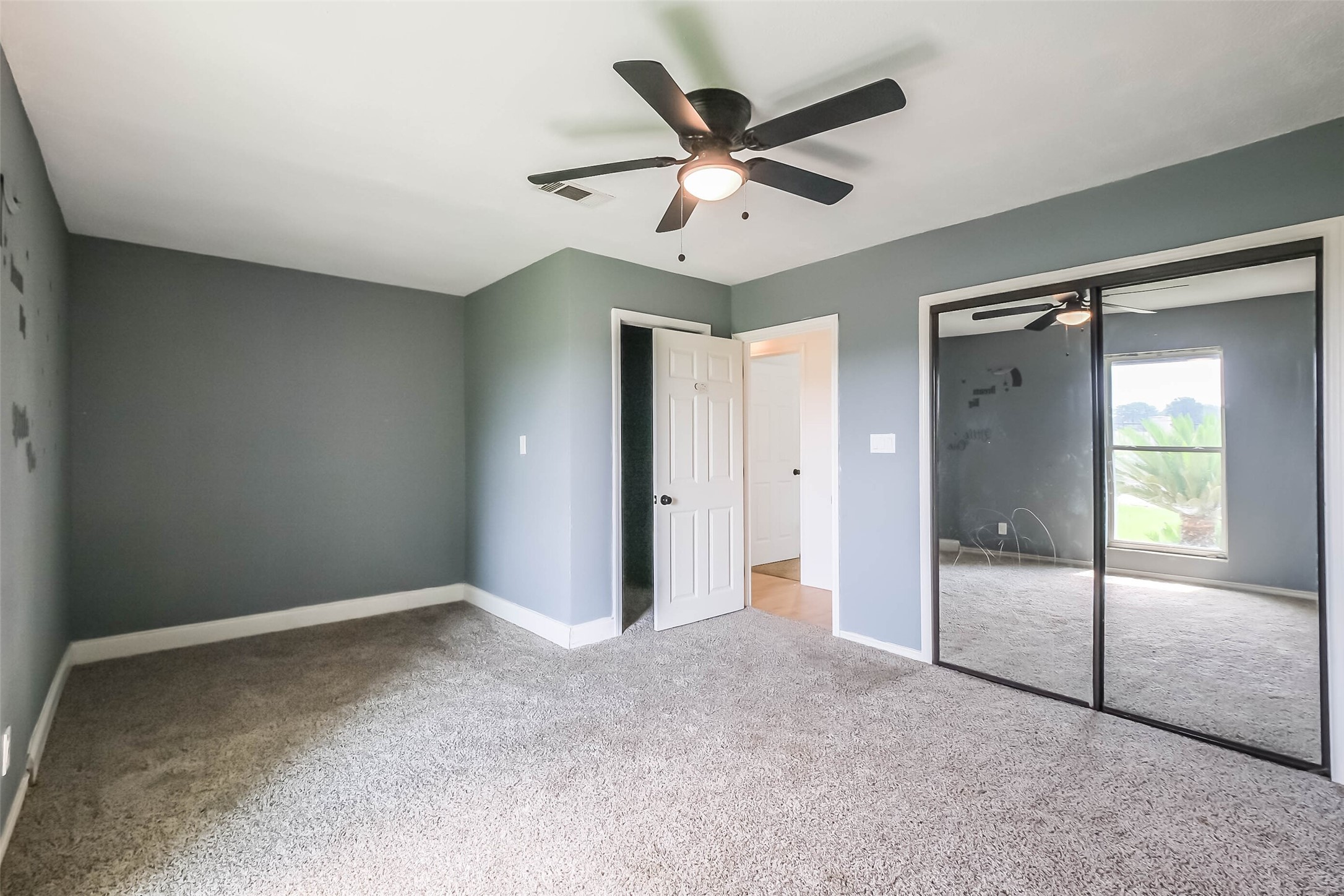 11019 Clodine Road Sugar Land, TX 77498 - Photo 22 of 39 a view of a livingroom with a ceiling fan and window