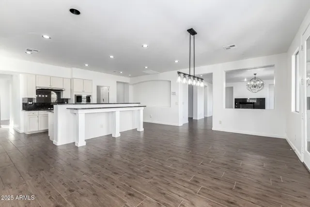a bathroom with a sink toilet and a mirror