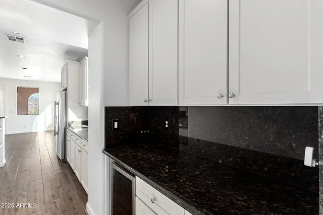 a view of a two chairs and table in a balcony