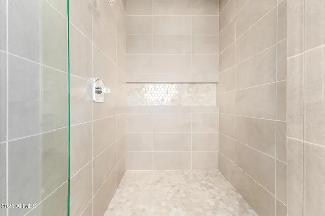 a white bath tub sitting next to a white toilet