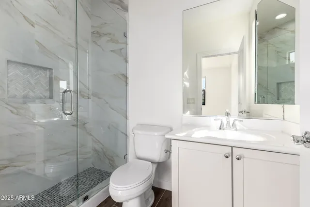 a view of swimming pool with outdoor seating and plants