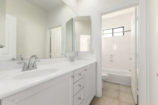 a bath tub sitting next to a window