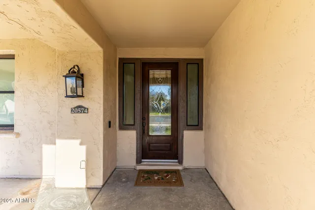 a view of a hallway view with wooden floor and staircase