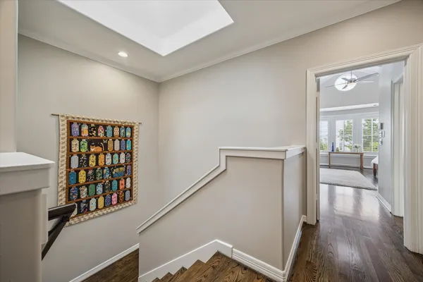 a view of staircase with white walls and railing