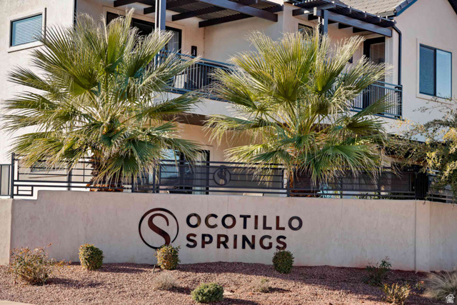 2600 Ocotillo Way, Unit 31 Santa Clara, UT 84765 - Photo 69 of 73 Entry monument featuring the property name, "Ocotillo Springs," set against a desert-style landscape with gravel and low-lying shrubs