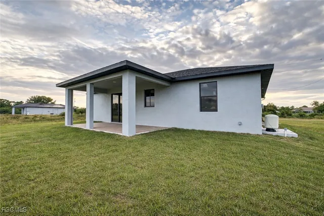 a aerial view of a house with a garden and deck